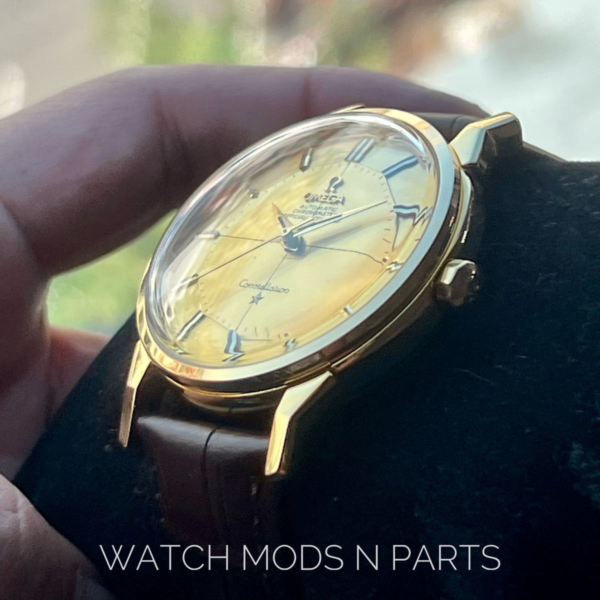 An Omega Constellation Pie Pan Cross Hair Gold Dial