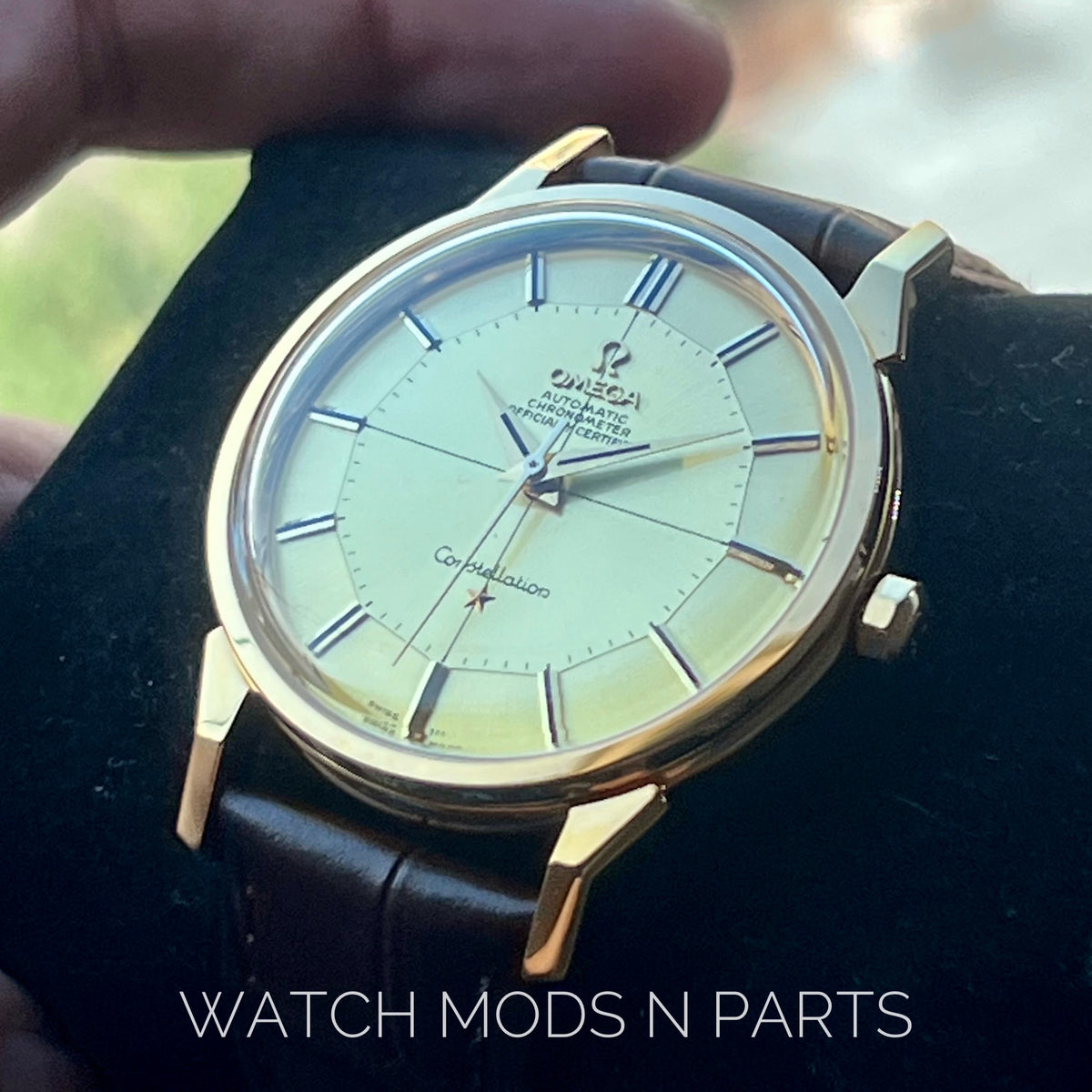 An Omega Constellation Pie Pan Cross Hair Gold Dial