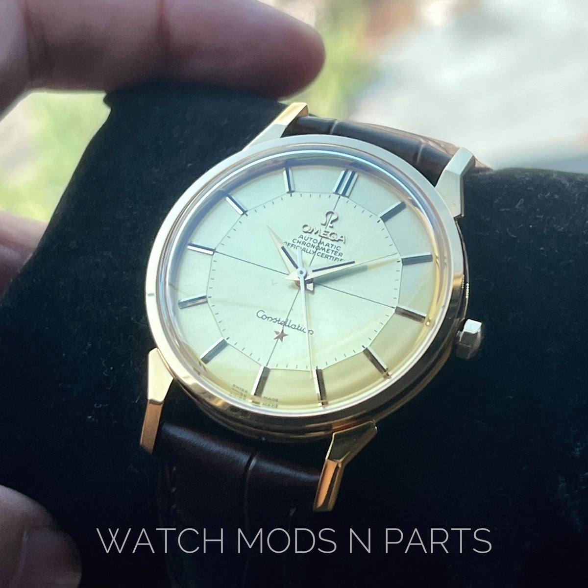 An Omega Constellation Pie Pan Cross Hair Gold Dial