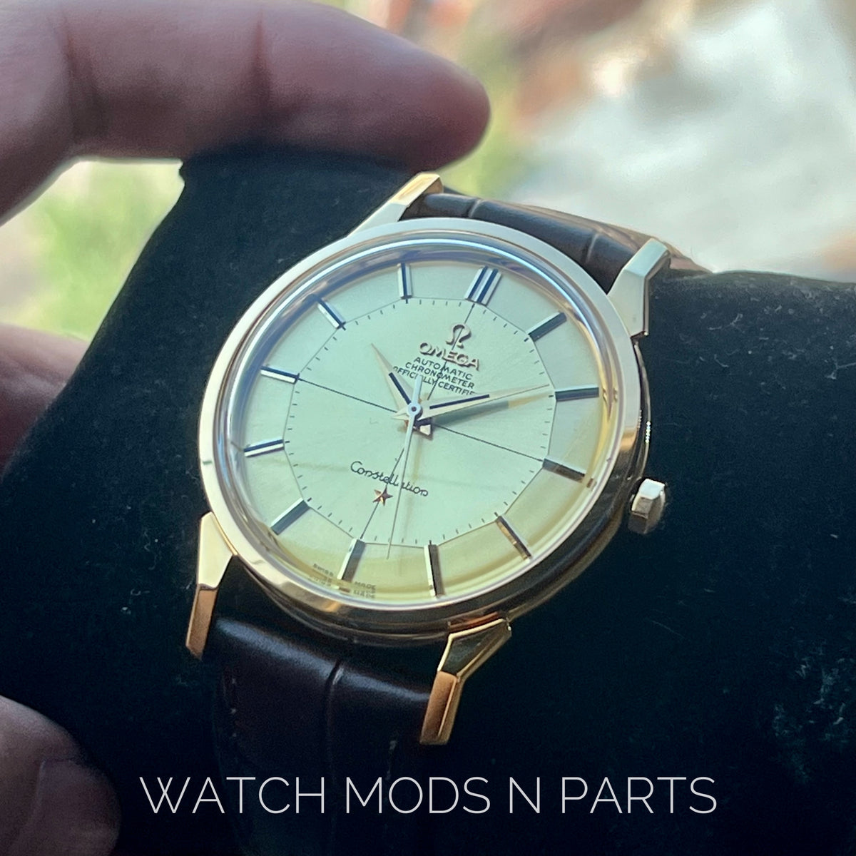 An Omega Constellation Pie Pan Cross Hair Gold Dial
