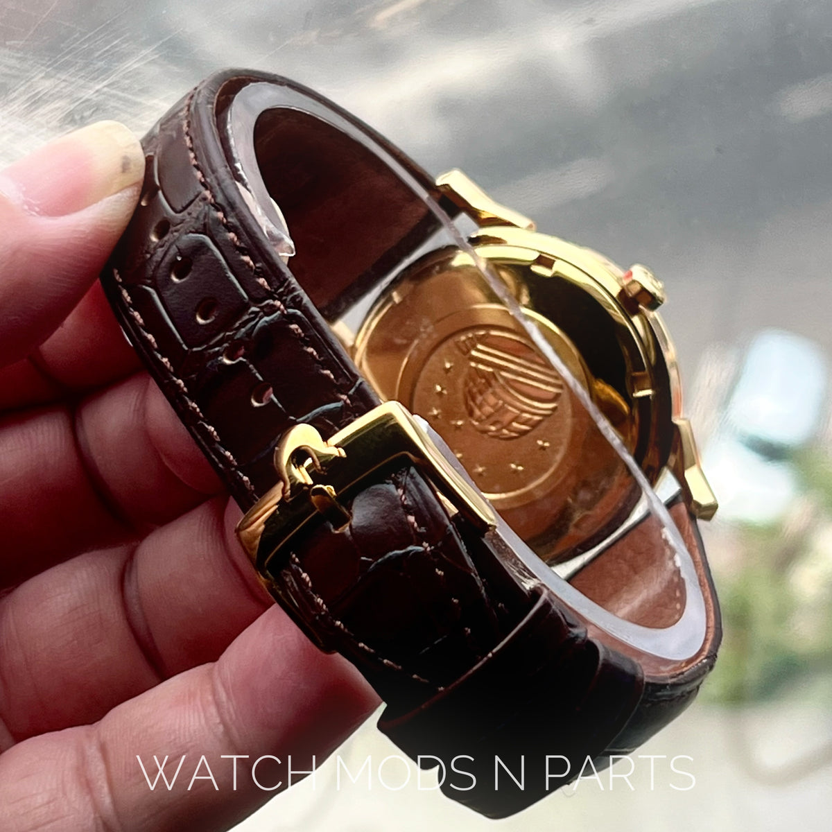 An Omega Constellation Pie Pan Cross Hair Gold Dial