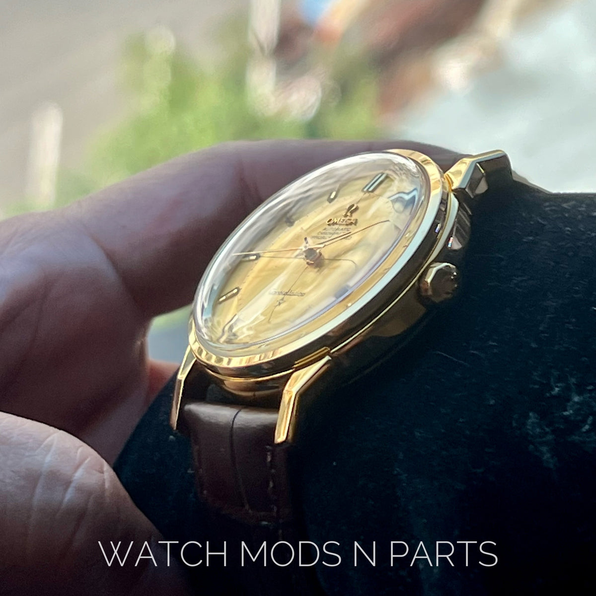 An Omega Constellation Pie Pan Cross Hair Gold Dial